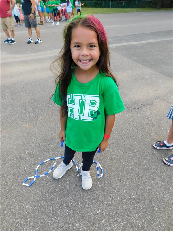 Students outside enjoying a family fun night for their school.